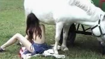 Horny redhead enjoying brutal sex with a pony